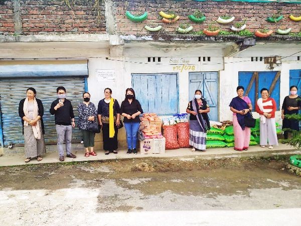 Members of Naga Mothers' Association (NMA) handing over essential items for quarantine centre at Peren.